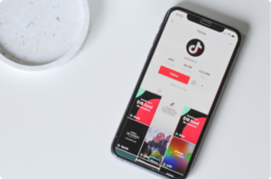 A phone with TikTok opened on it for someone who needs to learn about Taxes for TikTok Creators